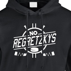 May include: Black hooded sweatshirt with a white graphic design that says "No Regretzkys" with a hockey puck and sticks.