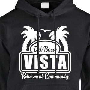 May include: Black hooded sweatshirt with a white graphic design of palm trees and the text "Del Boca VISTA Retirement Community".