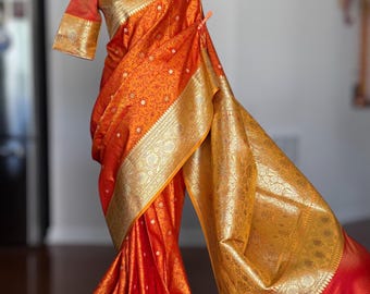 Orange color Pure Banaras Satin Mashru Silk Saree with stitched blouse