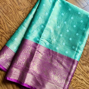 Mint green color with pink color combination tissue silk saree with  stitched blouse