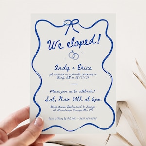 May include: Blue and white wedding announcement card with a hand-drawn border. The card says "We eloped!" and includes the couple's names, wedding date, and details for a celebration.