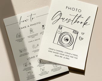 May include: Two off-white cards with black text and line art. One card reads PHOTO GUESTBOOK with a camera illustration. The other card provides instructions on how to take a photo, take a selfie, and load film into a camera.