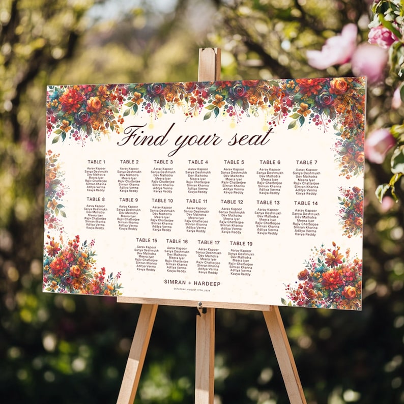 May include: A wedding seating chart on a wooden easel. The sign features a floral border with the words "Find your seat" at the top. The names of guests are listed under table numbers 1-19.