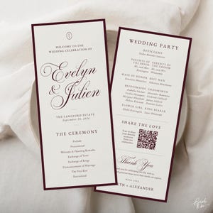 May include: Two rectangular wedding program cards with dark burgundy borders and cream backgrounds. The front features the names Evelyn & Julien, the date September 20, 2026, and ceremony details. The back lists the wedding party and a QR code.