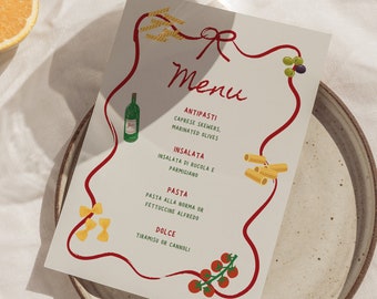 May include: A white menu card with a red ribbon design. The menu features Italian dishes, including antipasti, insalata, pasta, and dolce. The text on the menu card reads: "Menu, Antipasti, Caprese Skewers, Marinated Olives, Insalata, Insalata di Rucola e Parmigiano, Pasta, Pasta alla Norma or Fettuccine Alfredo, Dolce, Tiramisu or Cannoli."
