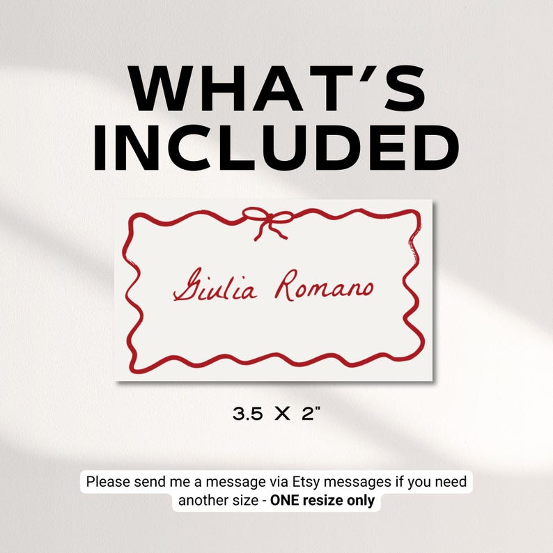 May include: A white label with a red wavy border and a red bow at the top. The text "Giulia Romano" is written in red cursive inside the label. The label is 3.5 inches by 2 inches.