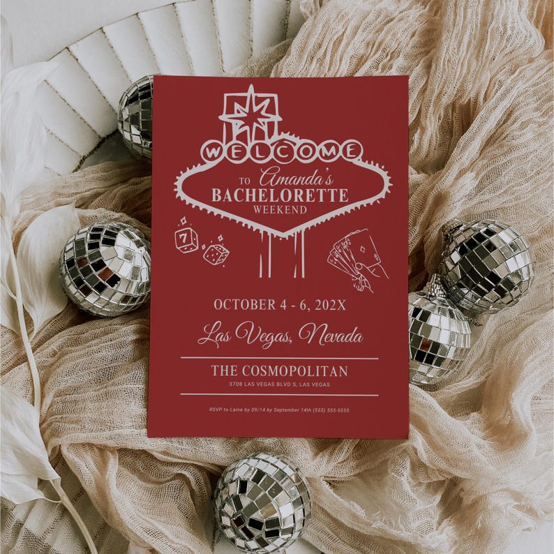May include: Red invitation card with a white outline of the Las Vegas Welcome sign. The text reads "Welcome to Amanda's Bachelorette Weekend, October 4-6, 202X, Las Vegas, Nevada, The Cosmopolitan, 3708 Las Vegas Blvd S, Las Vegas".