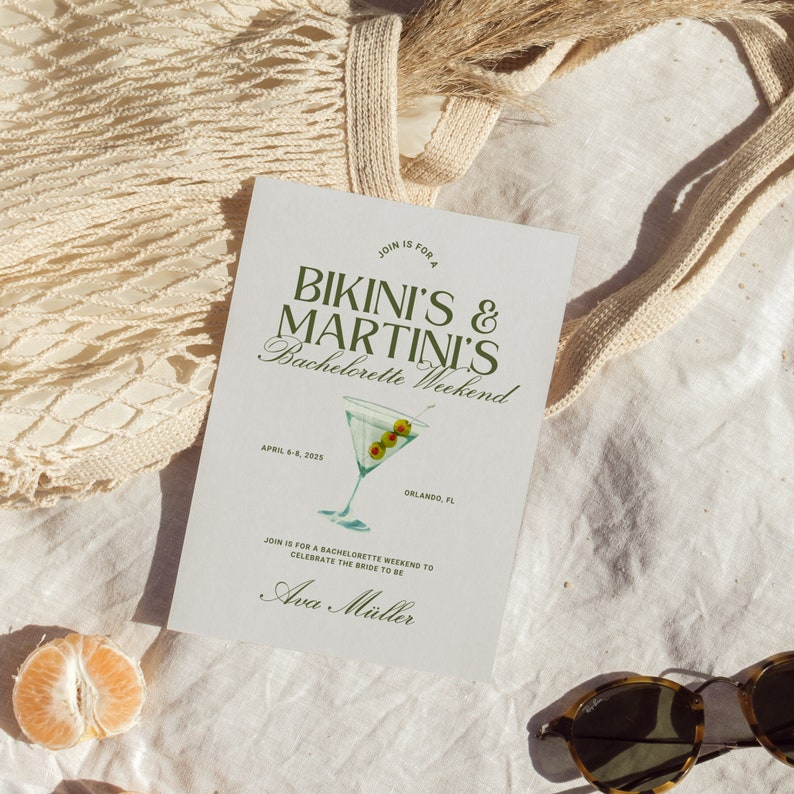 May include: A white card with green text that reads "Join is for a Bikini's & Martini's Bachelorette Weekend" with a green illustration of a martini glass with olives. The card also includes the text "April 6-8, 2025 Orlando, FL" and "Join is for a bachelorette weekend to celebrate the bride to be Ava M&uuml;ller."