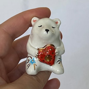 Handmade ceramic porcelain miniature figurine Bear holding a heart. Gold Lustre