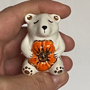 Handmade ceramic porcelain miniature figurine Bear holding flower. Gold Lustre