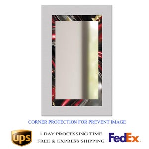 May include: A rectangular mirror with a white textured frame. The mirror's inner frame features a red, black, and gold marbled design. The text "CORNER PROTECTION FOR PREVENT IMAGE" is at the bottom.
