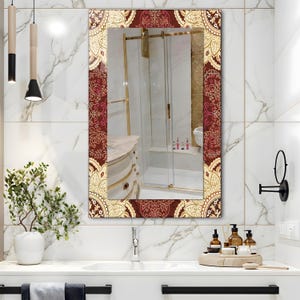 May include: Rectangular wall mirror with a decorative border featuring a burgundy and gold floral pattern. The mirror is mounted above a white sink in a bathroom setting. The mirror reflects the bathroom interior, including a shower and vanity.