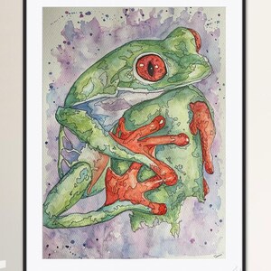 May include: Watercolour painting of a green and red frog with a purple and white background. The frog is curled up with its legs tucked under its body.