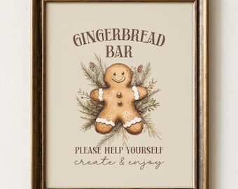 Op de afbeelding: Een ingelijste wandprint met een illustratie van een bruine peperkoekman tussen dennentakken. De tekst GINGERBREAD BAR, PLEASE HELP YOURSELF en create & enjoy staat in bruine letters op een lichtbeige achtergrond in een donkere lijst.
