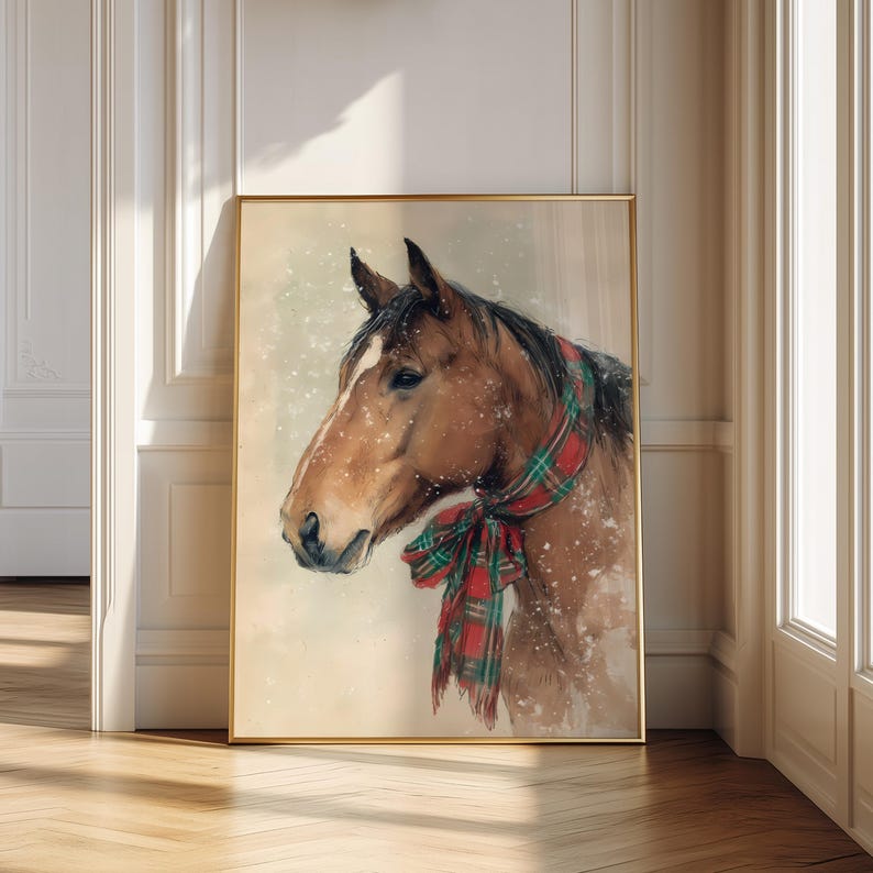 Vintage style horse wearing a red and green tartan bow with snow falling on a beige background, rustic printable farmhouse Christmas wall art.