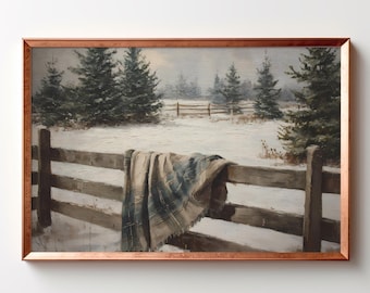 May include: A framed oil painting depicting a snowy winter landscape with a wooden fence in the foreground. A plaid blanket in shades of blue, gray, and cream is draped over the fence rails. Evergreen trees stand in the snow-covered field.