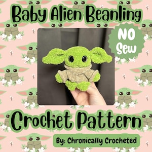 May include: A green crocheted Baby Alien Beanling doll with large ears and black eyes. The doll is wearing a tan outfit. The image includes the text "Baby Alien Beanling", "Crochet Pattern", and "No Sew". The pattern is by Chronically Crocheted.