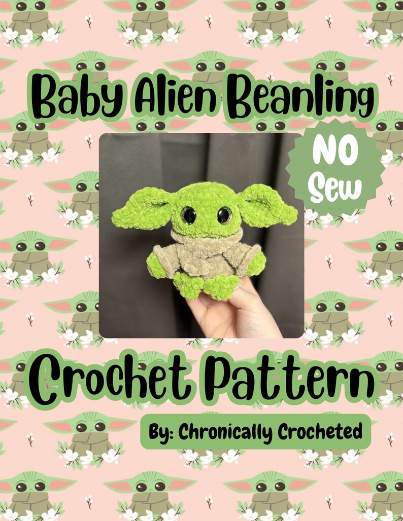 May include: A green crocheted Baby Alien Beanling doll with large ears and black eyes, wearing a tan outfit. The image includes the text "Baby Alien Beanling", "Crochet Pattern", and "No Sew". The pattern is by Chronically Crocheted.