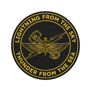 May include: A round, black patch with gold lettering and a central emblem. The text reads "LIGHTNING FROM THE SKY" and "THUNDER FROM THE SEA". The emblem features a winged design with a sword, lightning bolt, and hammer.