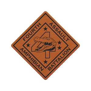 May include: A diamond-shaped orange patch featuring a black border and the text FOURTH ASSAULT AMPHIBIAN BATTALION. A large black number 4 is centered behind a detailed black illustration of an alligator head, accented by four small black stars.