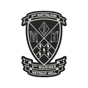 May include: A black and white patch featuring the text "2ND BATTALION" at the top and "5TH MARINES RETREAT HELL" at the bottom. The patch has a shield design with a diamond pattern and seahorse symbols.