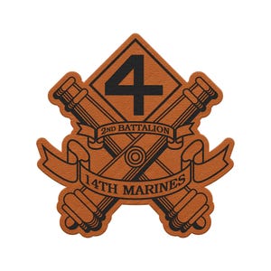 May include: A tan leather-textured patch featuring a black graphic of two crossed cannons behind a diamond shape with the number 4. Two banners are layered over the cannons, with the text 2ND BATTALION on the top and 14TH MARINES on the bottom.