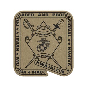 May include: Tan patch with black text and graphics. The patch reads "Prepared and Professional" around the border. The center features crossed swords, the words "2nd Battalion" and "23rd Marines", and the text "Kwajalein".