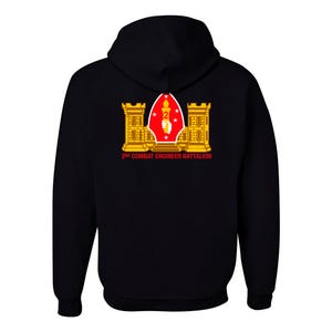 May include: Black hooded sweatshirt with a graphic on the back. The graphic features a red and white emblem with the text "2nd Combat Engineer Battalion" in red. The emblem includes a torch, the number "2", and two gold towers.