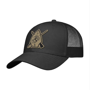 May include: Black baseball cap with a mesh back and a curved brim. The cap features a tan patch with the number 8, crossed rifles, and an emblem. The cap is a classic style.