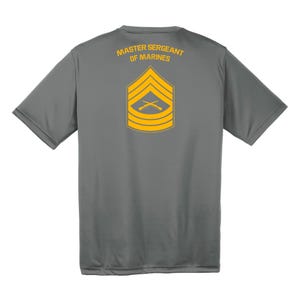 May include: A gray t-shirt with the text "Master Sergeant of Marines" and a yellow rank insignia on the back.