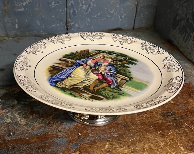 Vintage cake / fruit / snacks stand in porcelain / faience with detailed decorated love story motif, gold gilt, rococo style, ironstone