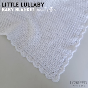 May include: White crochet baby blanket with a scalloped edge. The blanket is made with a simple stitch pattern and has a soft, fluffy texture. The text "LITTLE LULLABY BABY BLANKET crochet pattern" is at the top of the image.