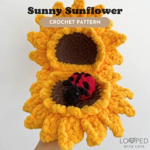 May include: Crochet pattern for a sunny sunflower with a ladybug inside. The sunflower is yellow and brown, and the ladybug is red and black. The pattern is called "Sunny Sunflower Crochet Pattern" and is by "Looped with Love".