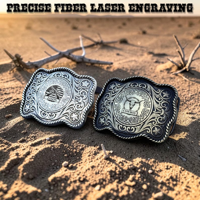 May include: Two metal belt buckles with intricate engraved designs. One is silver with an American flag and the name "Jason", the other is black with a bull skull and the word "Cowboy". The text "PRECISE FIBER LASER ENGRAVING" is at the top.