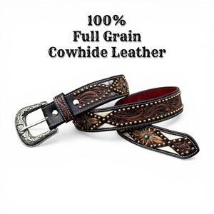 May include: A brown and black full-grain cowhide leather belt with a decorative floral pattern, turquoise accents, and a silver buckle. The text "100% Full Grain Cowhide Leather" is displayed above the belt.
