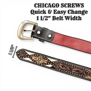 May include: A detailed view of a brown leather belt with a silver buckle. The belt features decorative floral and geometric patterns, a turquoise stone, and the text "CHICAGO SCREWS Quick & Easy Change 1 1/2" Belt Width".
