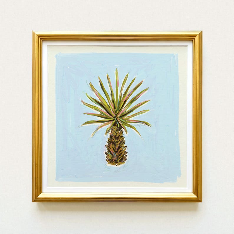 The image is a framed painting of a palm tree with a green and brown color palette.