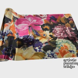 May include: A roll of craft foil featuring a vibrant floral pattern with large pink, orange, yellow, and purple blossoms set against a deep black background. The text artistic painting studio is printed in black in the bottom right corner.