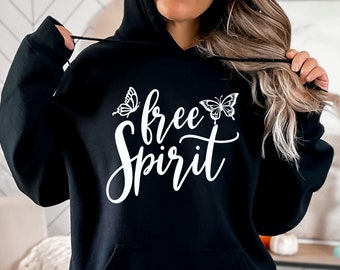 May include: Black hooded sweatshirt with the text "free spirit" in white lettering and two butterfly graphics.