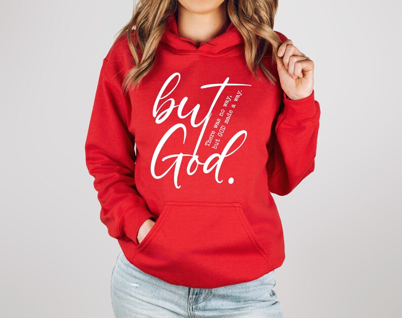 May include: A red hooded sweatshirt with a front pocket and white text that reads "but God." Additional text on the right side of the graphic reads "There was no way, but GOD made a way."