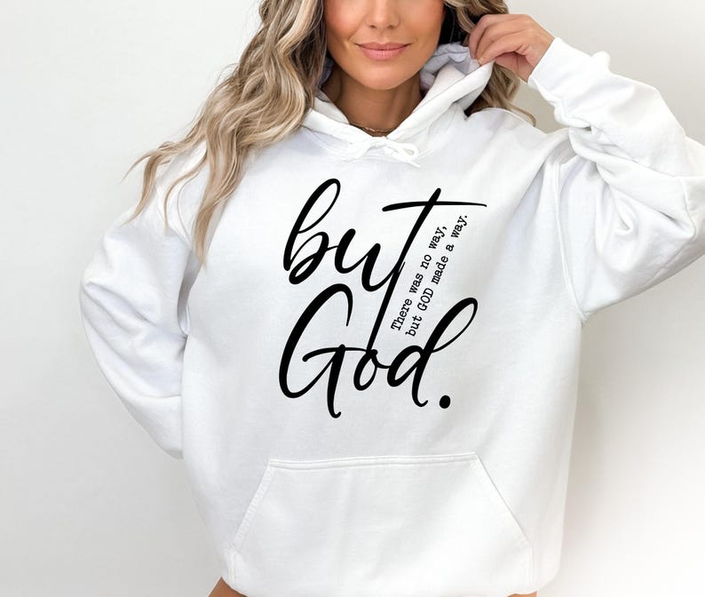 May include: White hooded sweatshirt with a front pocket and the words "but God" in black script. The phrase "There was no way, but GOD made a way" is printed vertically on the right side of the design.