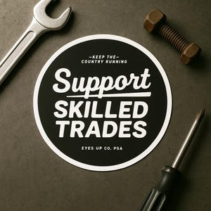 May include: A black and white circular sticker with the text "Support Skilled Trades" and the phrase "Keep the Country Running." A wrench, a bolt, and a screwdriver are arranged around the sticker on a dark surface.
