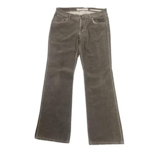 May include: A pair of olive green corduroy pants. The pants have a classic five-pocket design with a button and zipper closure. The fabric has a soft, textured appearance. The pants are designed with a slight flare at the bottom of the legs.
