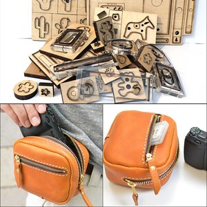 May include: A set of leather craft tools for cutting out shapes, including a cactus, a star, a bear, a horse, and a flower. The tools are made of wood and metal and are arranged on a white surface. The image also shows a brown leather camera bag with a zipper and a small pocket on the front.
