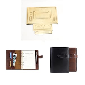 May include: A brown leather planner with a black leather cover, a pen holder, and a phone pocket. The planner has a ring binder system and a flap closure. The planner is shown next to a wooden template for making a leather planner.