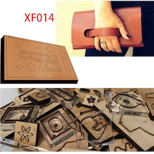 May include: A set of leather craft cutting dies for making a clutch purse. The dies are made of clear plastic and are arranged in a pile. The dies include shapes for a heart, a flower, and a rectangle. The image also shows a brown leather clutch purse with a handle.