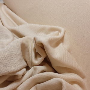 Knitted viscose fabric in cream/ Knitted viscose fabric Made in Germany