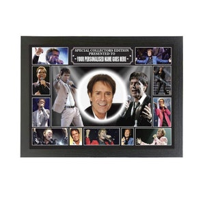 May include: A black framed collage of photos of a male singer. The photos are arranged in a grid pattern and feature the singer in various poses and settings. The collage is titled "Special Collectors Edition Presented To - Your Personalised Name Goes Here - "