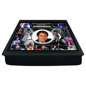 May include: A black tray with a padded cushion, featuring a collage of photos of a man in various poses. The tray has a black frame and a white label that reads "Special Collectors Edition Presented To - Your Personalised Name Goes Here - "