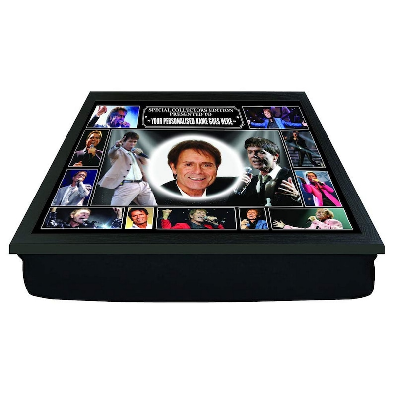 May include: A black tray with a padded cushion, featuring a collage of photos of a man in various poses. The tray has a black frame and a white label that reads "Special Collectors Edition Presented To - Your Personalised Name Goes Here - "